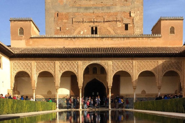 a group of people standing in front of a building